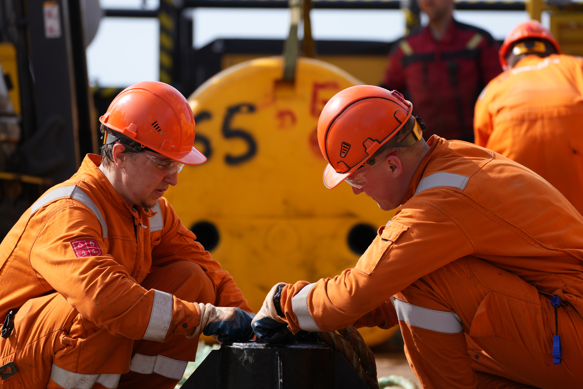 CME offshore crew performing rigging and lifting operations on deck